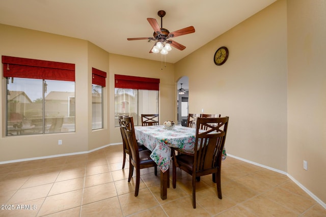 10242 E Pantera Ave, Mesa, AZ 85212 - dining room with a ceiling fan, light tile patterned flooring, baseboards, and arched walkways