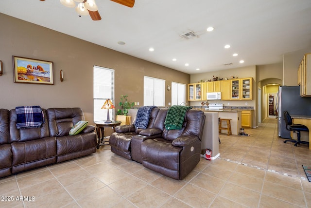 10242 E Pantera Ave, Mesa, AZ 85212 - living room featuring arched walkways, a ceiling fan, light tile patterned floors, and recessed lighting