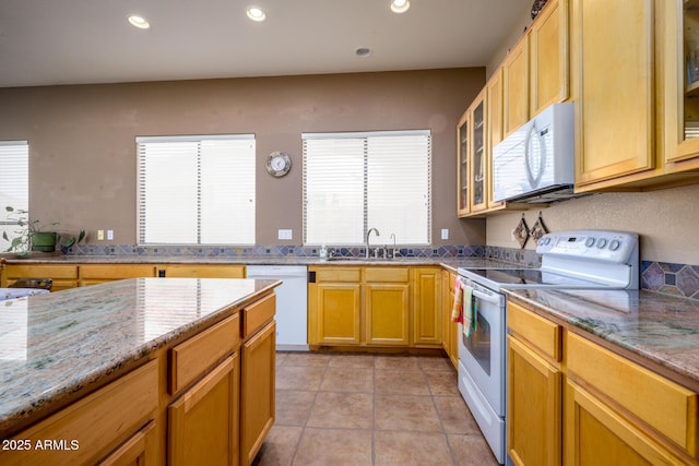 10242 E Pantera Ave, Mesa, AZ 85212 - kitchen with white appliances, recessed lighting, light stone countertops, glass insert cabinets, and light tile patterned floors