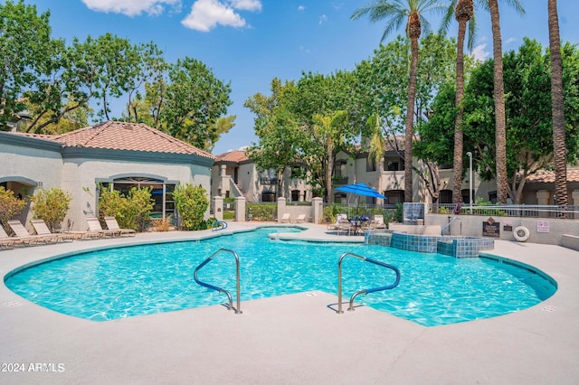 view of swimming pool featuring a patio area