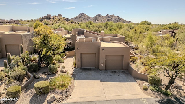 birds eye view of property featuring a mountain view