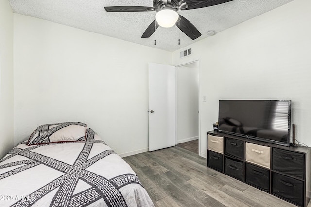 18818 N 12th Ave, Phoenix, AZ 85027 - bedroom featuring wood finished floors, a textured ceiling, and a ceiling fan