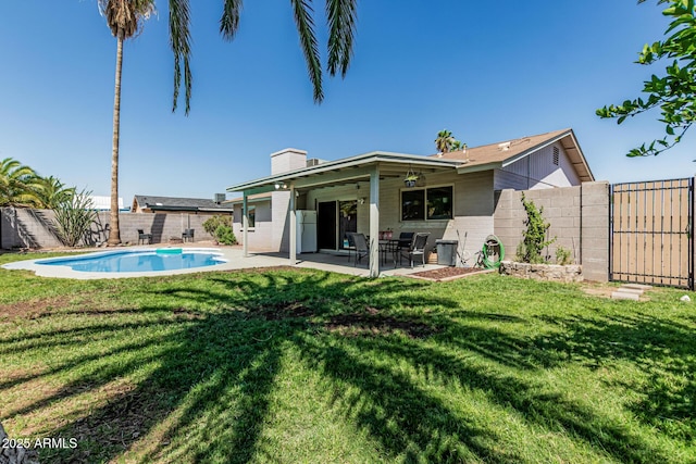 18818 N 12th Ave, Phoenix, AZ 85027 - back of property with a fenced backyard, a chimney, a patio area, and a gate