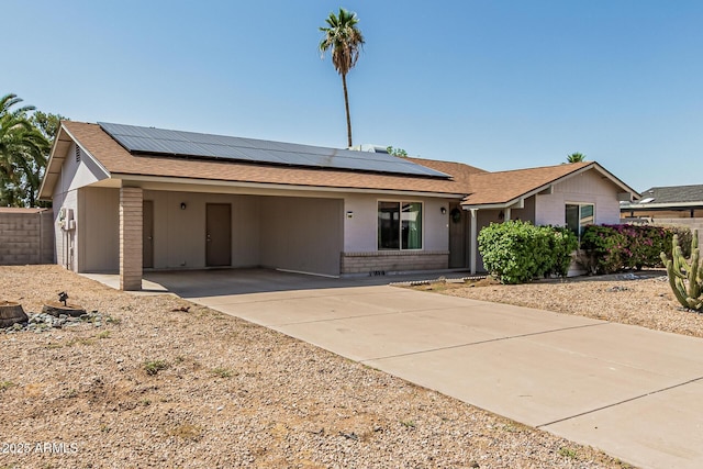18818 N 12th Ave, Phoenix, AZ 85027 - single story home featuring concrete driveway, roof mounted solar panels, an attached carport, and roof with shingles