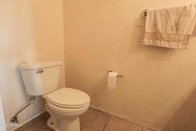 1831 E Pueblo Ave, Phoenix, AZ 85040 - bathroom with toilet, tile patterned flooring, and baseboards