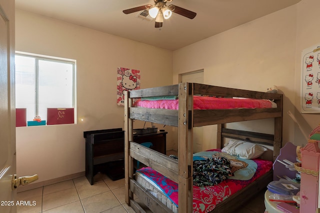1831 E Pueblo Ave, Phoenix, AZ 85040 - tiled bedroom with ceiling fan and baseboards