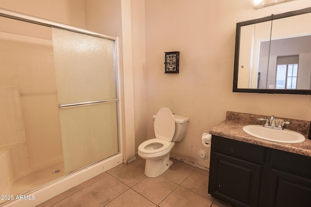 1831 E Pueblo Ave, Phoenix, AZ 85040 - bathroom featuring tile patterned floors, a shower stall, toilet, and vanity