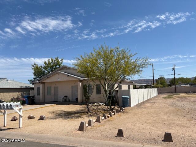 1831 E Pueblo Ave, Phoenix, AZ 85040 - view of front of house featuring fence and stucco siding