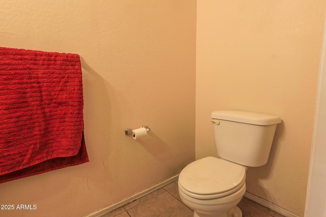 1831 E Pueblo Ave, Phoenix, AZ 85040 - bathroom with toilet, tile patterned flooring, and baseboards