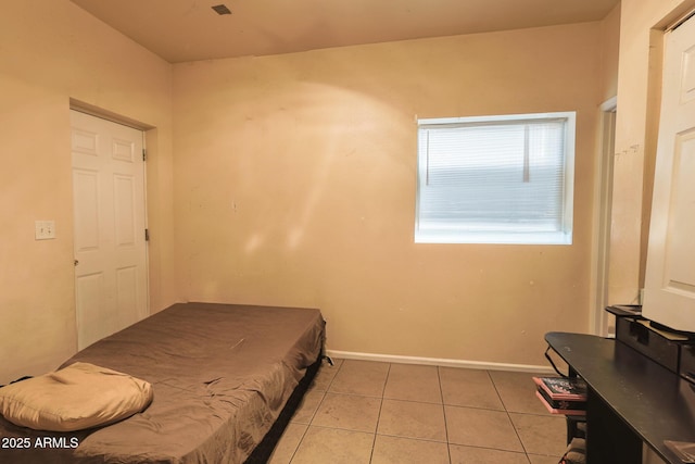1831 E Pueblo Ave, Phoenix, AZ 85040 - bedroom with light tile patterned flooring and baseboards