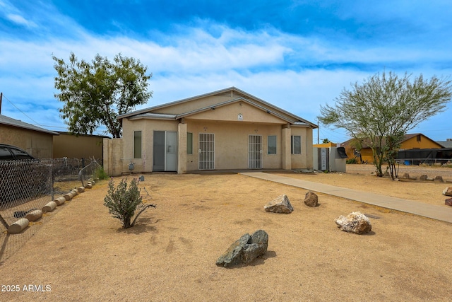 1831 E Pueblo Ave, Phoenix, AZ 85040 - rear view of property featuring fence and stucco siding