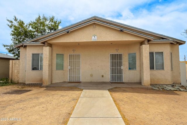 1831 E Pueblo Ave, Phoenix, AZ 85040 - view of front of home featuring stucco siding and a patio