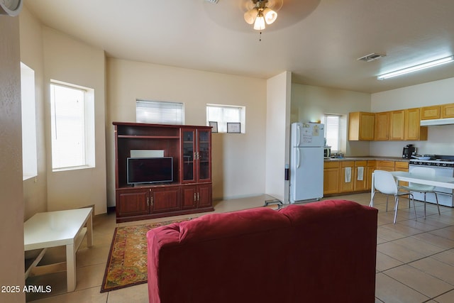 1831 E Pueblo Ave, Phoenix, AZ 85040 - living room featuring a ceiling fan and light tile patterned floors