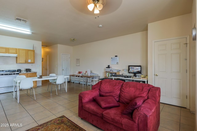 1831 E Pueblo Ave, Phoenix, AZ 85040 - living room featuring light tile patterned floors and ceiling fan