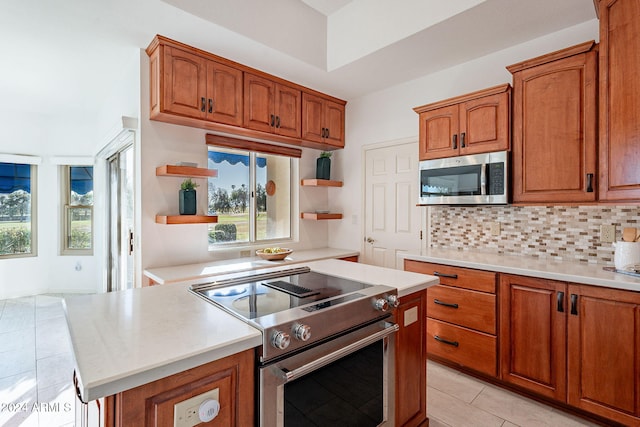 kitchen with tasteful backsplash and stainless steel appliances