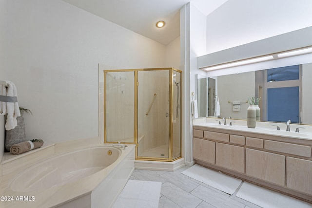 bathroom with tile patterned floors, vanity, shower with separate bathtub, and high vaulted ceiling