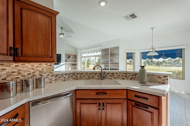 kitchen with lofted ceiling, decorative backsplash, sink, stainless steel dishwasher, and ceiling fan