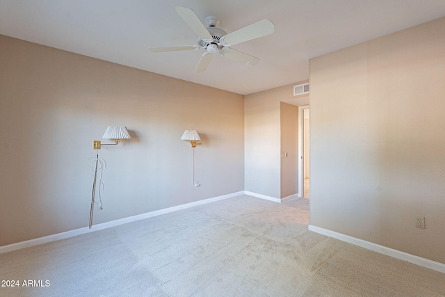 unfurnished room featuring carpet and ceiling fan