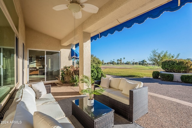 view of patio with ceiling fan and an outdoor living space