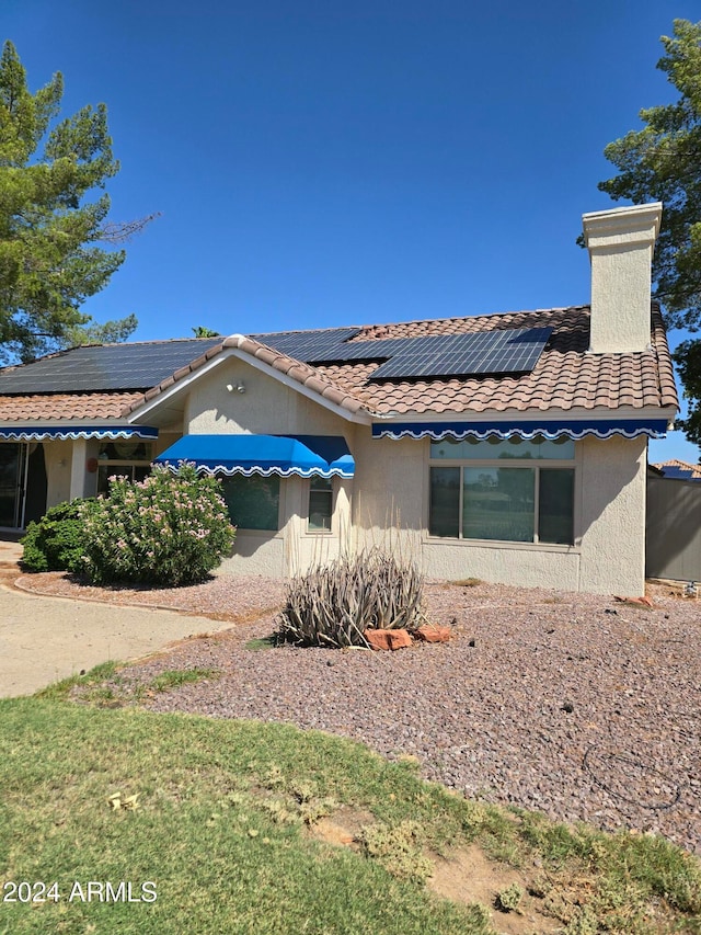 exterior space featuring solar panels