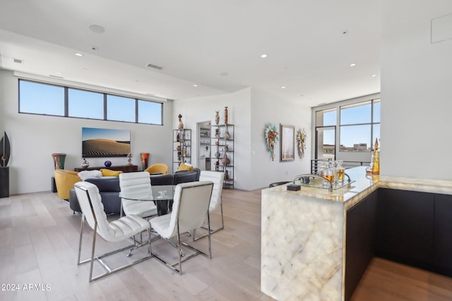 dining room with light hardwood / wood-style flooring