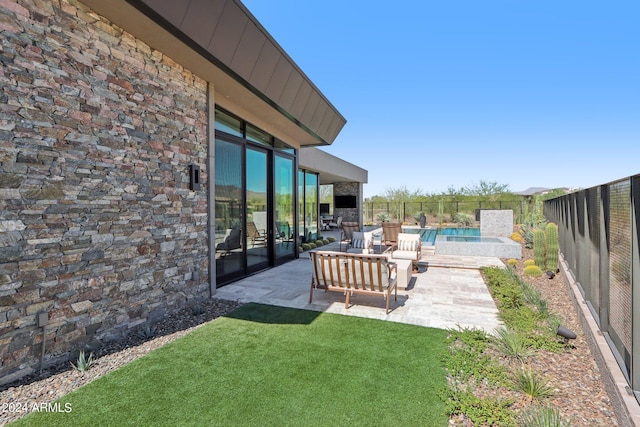 view of yard with a patio, a fenced in pool, and an outdoor hangout area