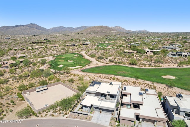 birds eye view of property with a mountain view