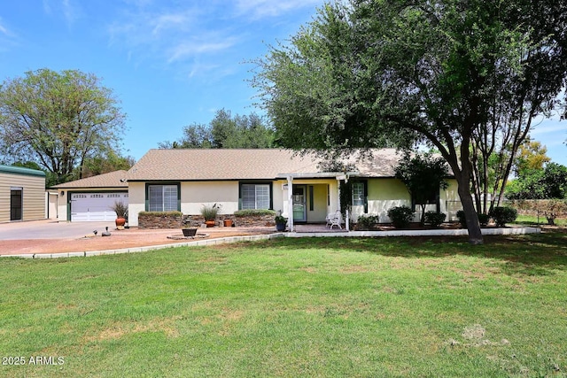 ranch-style house with stucco siding, concrete driveway, and a front lawn