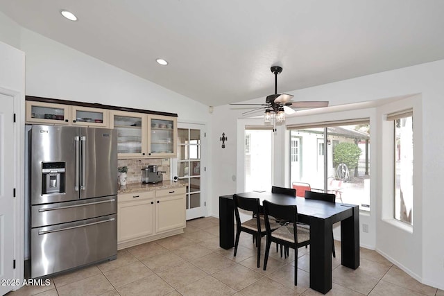 dining space featuring light tile patterned flooring, ceiling fan, vaulted ceiling, and recessed lighting
