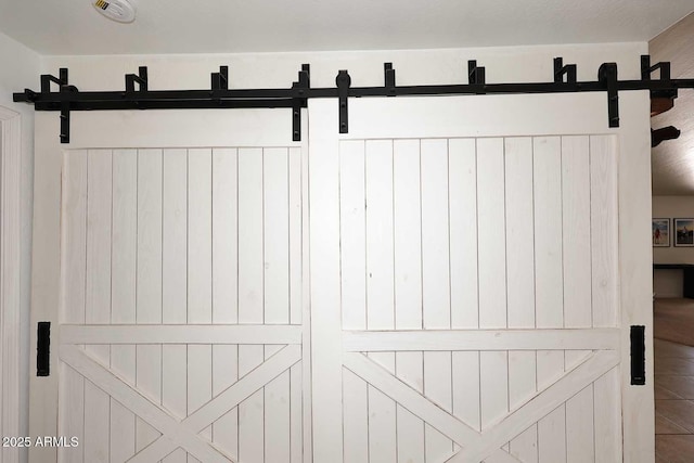 interior details featuring a barn door