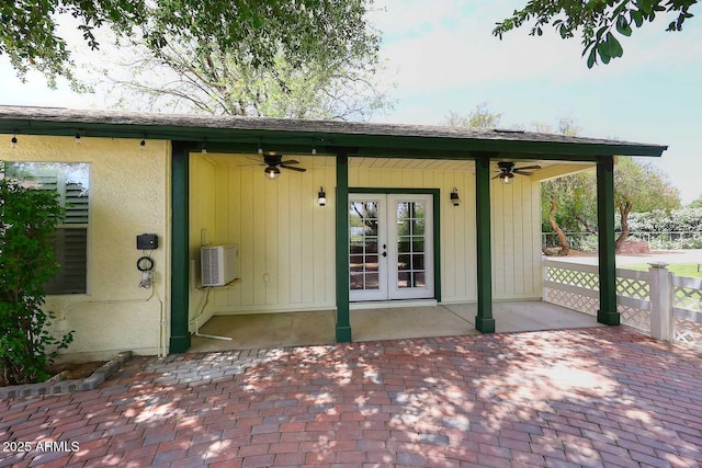 entrance to property featuring a ceiling fan, a patio area, and french doors