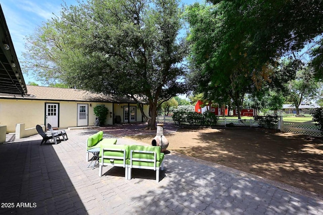 view of property's community with a patio and fence