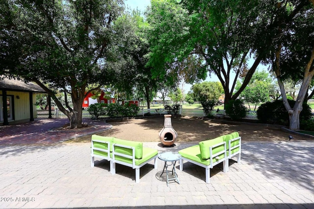 surrounding community featuring fence and a patio