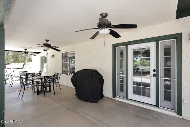 view of patio with outdoor dining area, grilling area, and ceiling fan