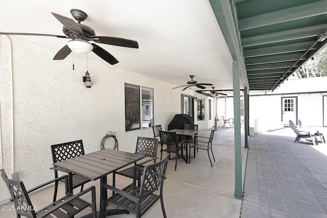 view of patio / terrace featuring ceiling fan and outdoor dining space