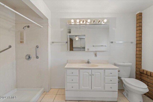 interior space with a textured ceiling, light brown cabinetry, and light tile patterned floors