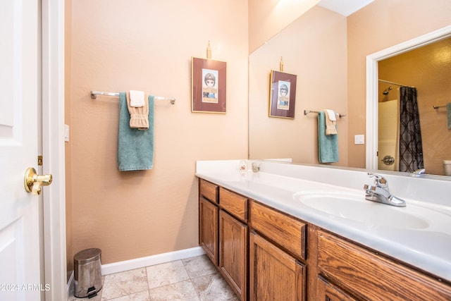 bathroom featuring tile patterned flooring and vanity