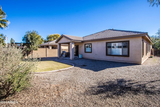 rear view of house featuring a patio