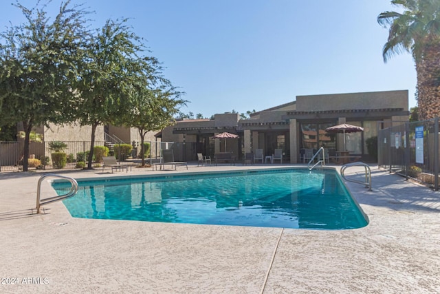 view of swimming pool featuring a patio