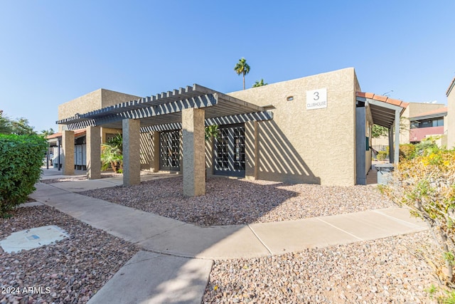 view of home's community featuring a pergola