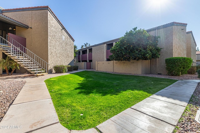 exterior space with a lawn