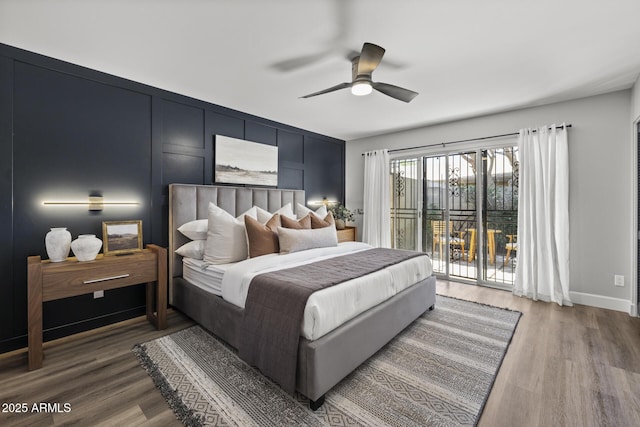 bedroom featuring ceiling fan, dark hardwood / wood-style flooring, and access to outside