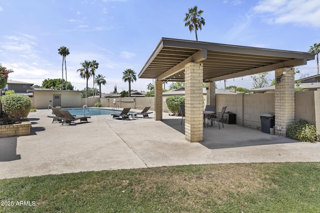 view of patio with a fenced in pool