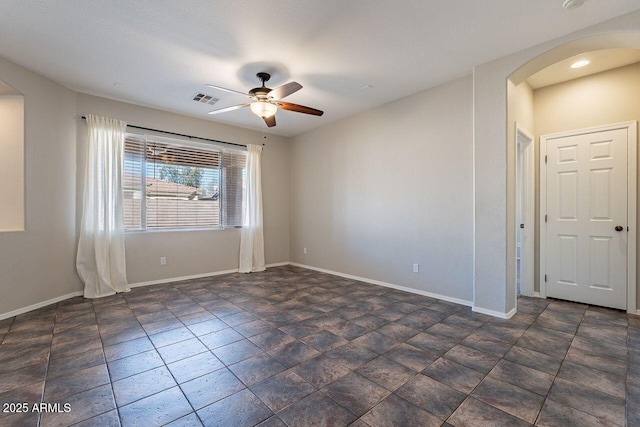 unfurnished room with ceiling fan