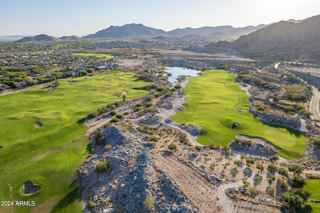 drone / aerial view featuring a water and mountain view