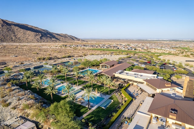 birds eye view of property with a mountain view