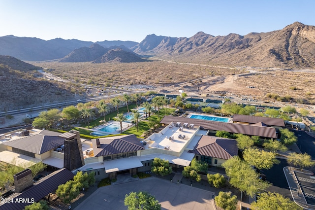 birds eye view of property featuring a mountain view