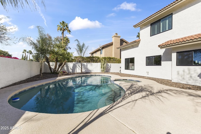 view of swimming pool featuring an in ground hot tub, a fenced backyard, and a fenced in pool