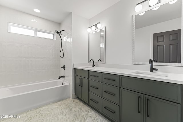 full bath with double vanity, tub / shower combination, a sink, and tile patterned flooring