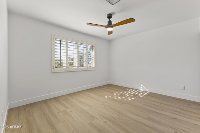 empty room featuring light wood-type flooring, ceiling fan, and baseboards